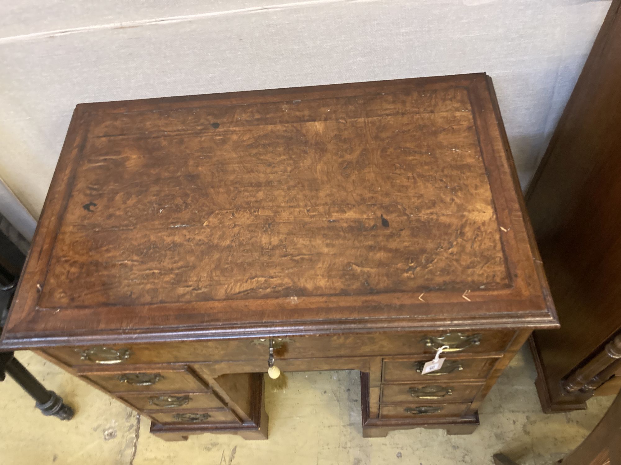 A George I style walnut kneehole desk, width 82cm, depth 49cm, height 78cm
